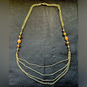 28” gold-tone chain necklace with 3 strand brown glass beading.